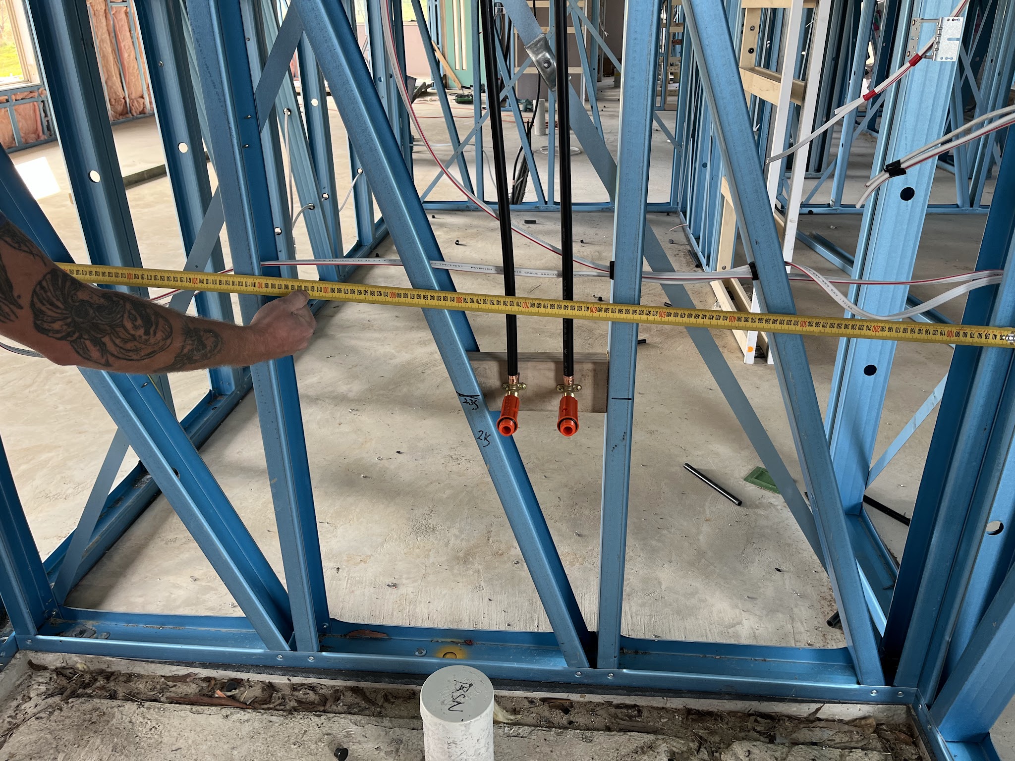 New build rough in inside a steel framed house, tap set outlets measured off the frame
